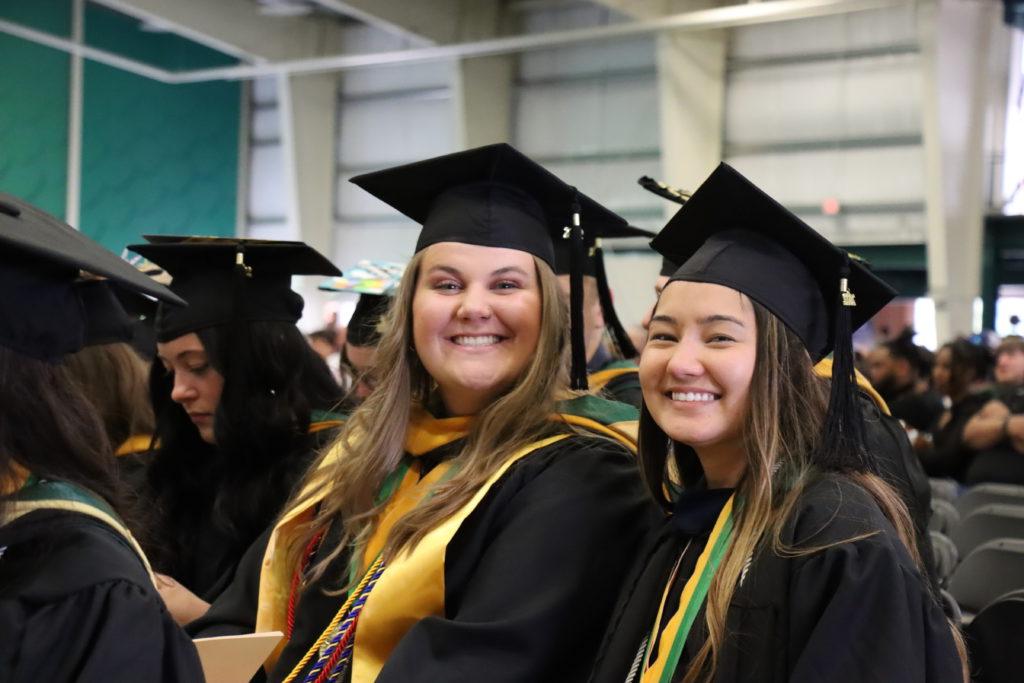 two smiling girls at graduattion